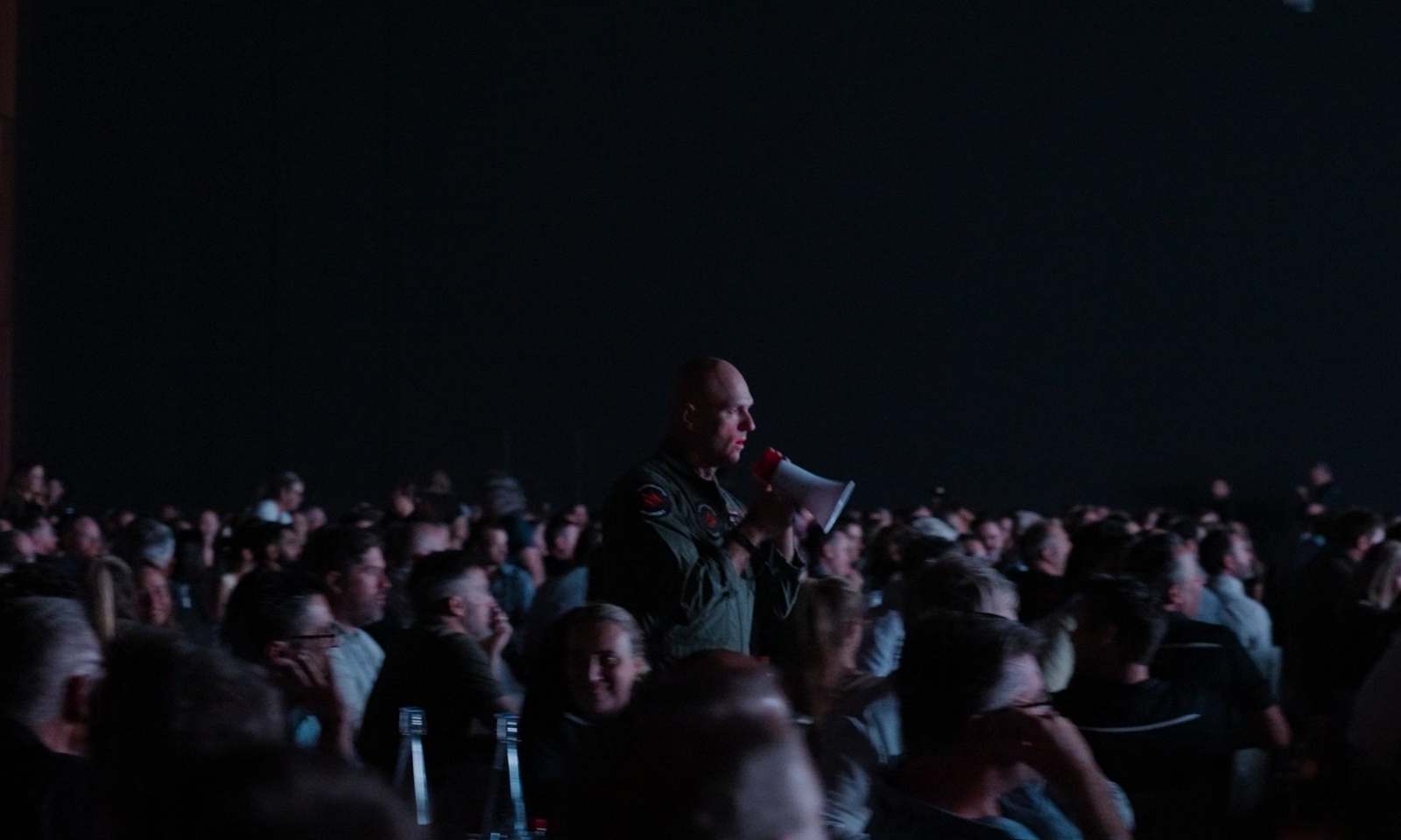 An Afterburner pilot addressing a room of delegates