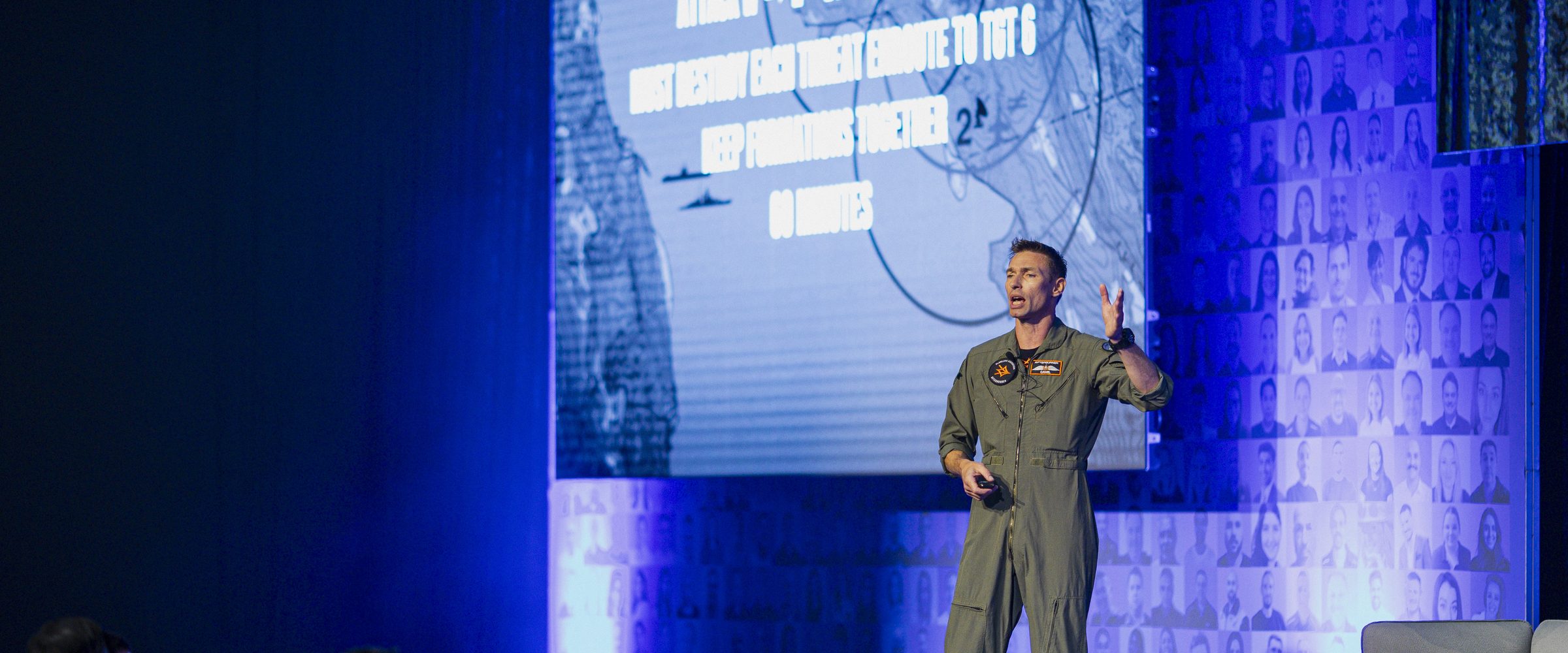 An Afterburner pilot presenting the Flawless Execution method on stage