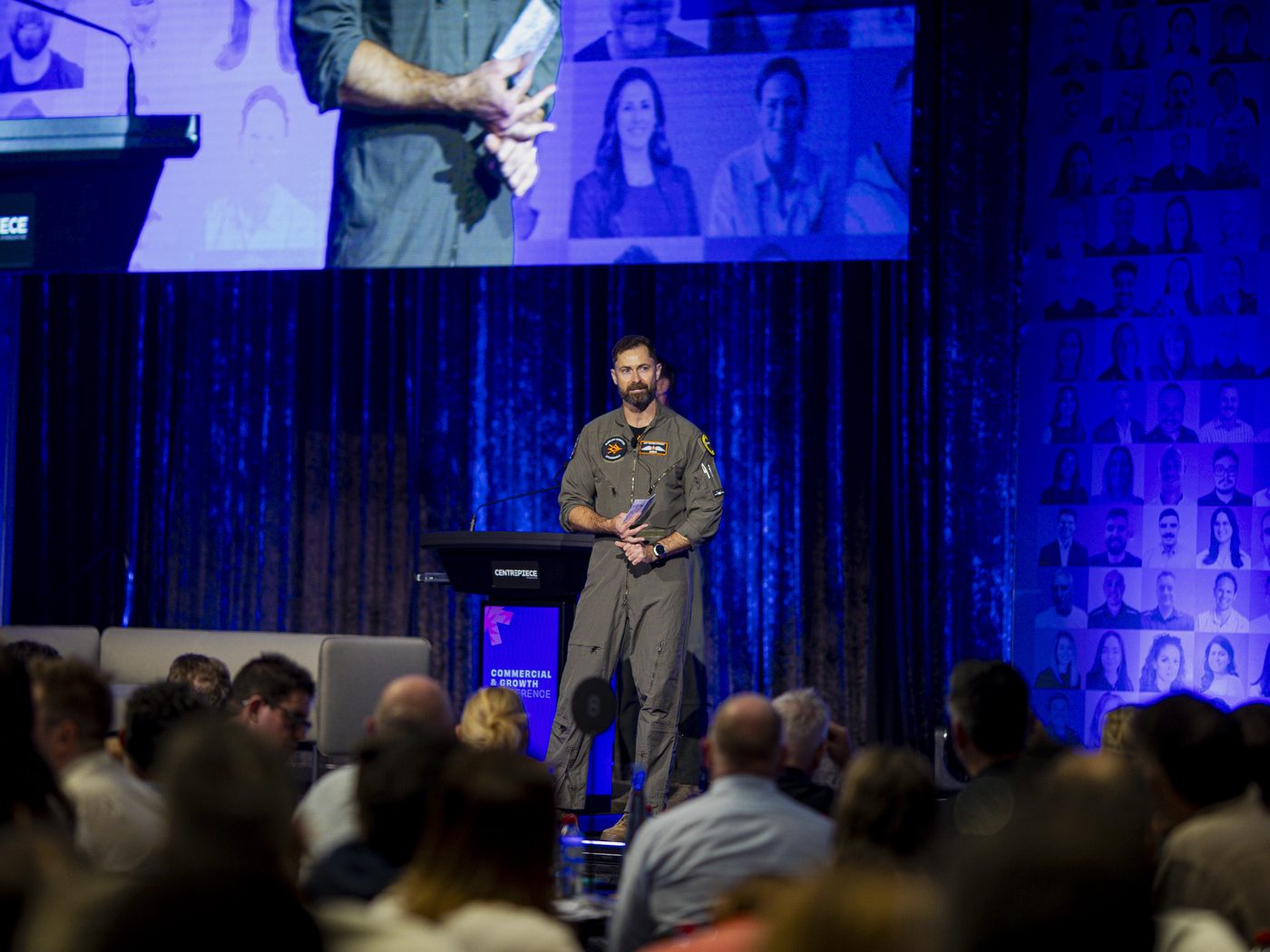 Chris 'Camel' Chmiel delivering an Afterburner keynote to a seated conference audience