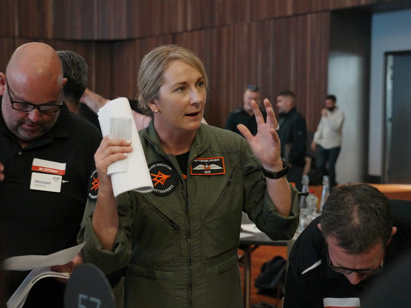 An Afterburner facilitator briefing a team during a mission planning session